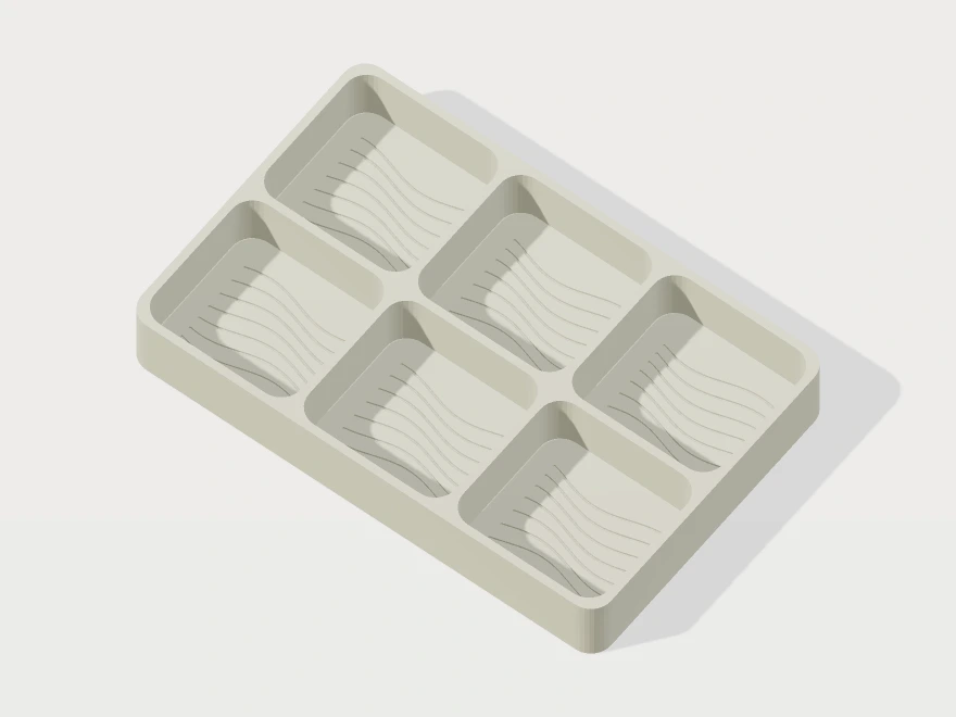 3D model preview of a six-compartment organizer with flowing contour lines engraved into each pocket floor